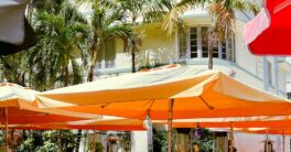An outdoor dining area with tables and umbrellas