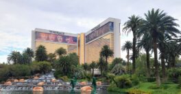 A view of a hotel from across a pond