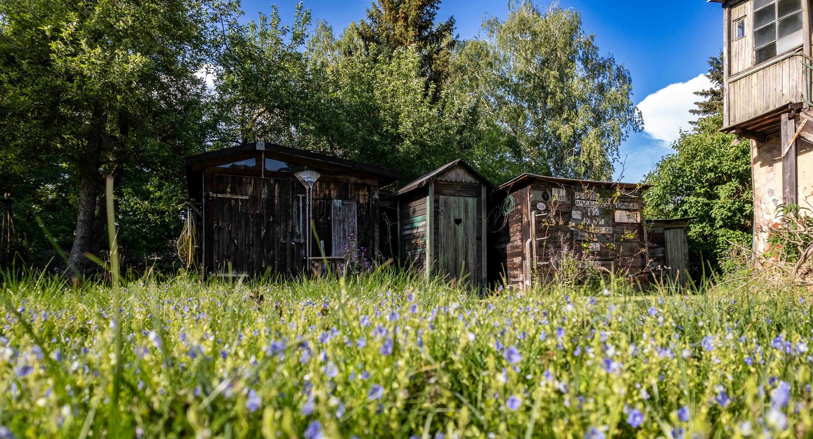 a group of out buildings sitting in the middle of a field