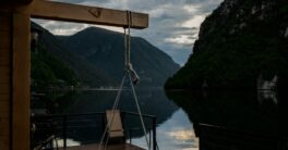 a swing hanging from the side of a boat